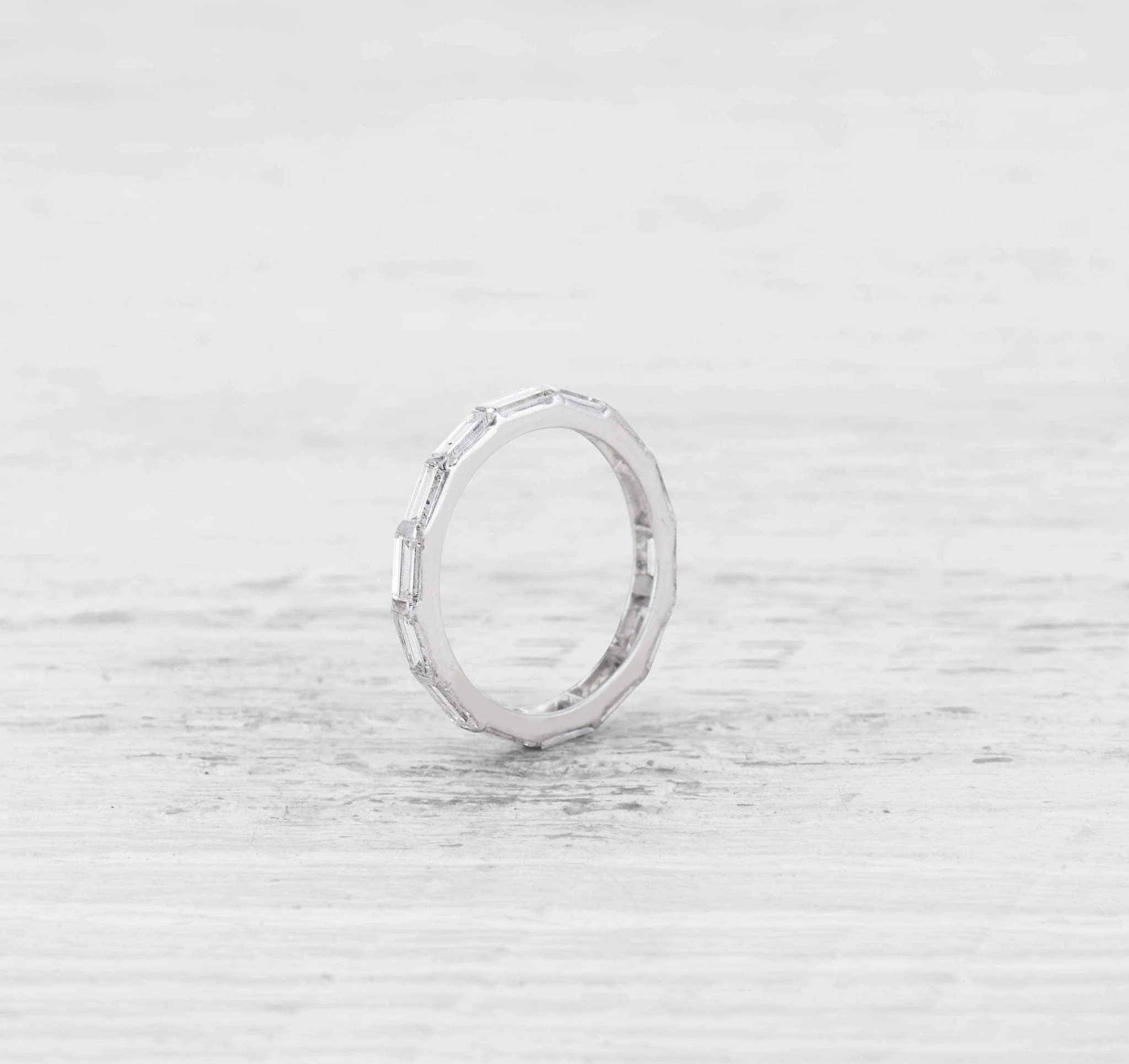 VINTAGE BAGUETTE CUT DIAMOND AND PLATINUM ETERNITY BAND