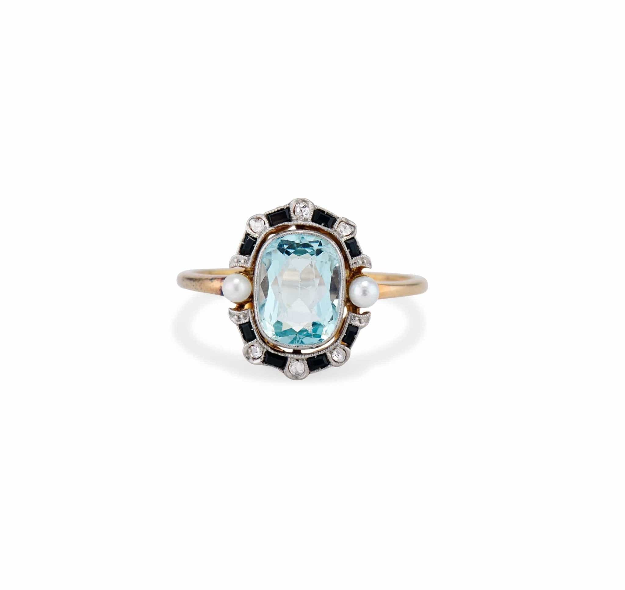 Edwardian 1.40 Carat Aquamarine, Diamond, Onyx, and Pearl Ring