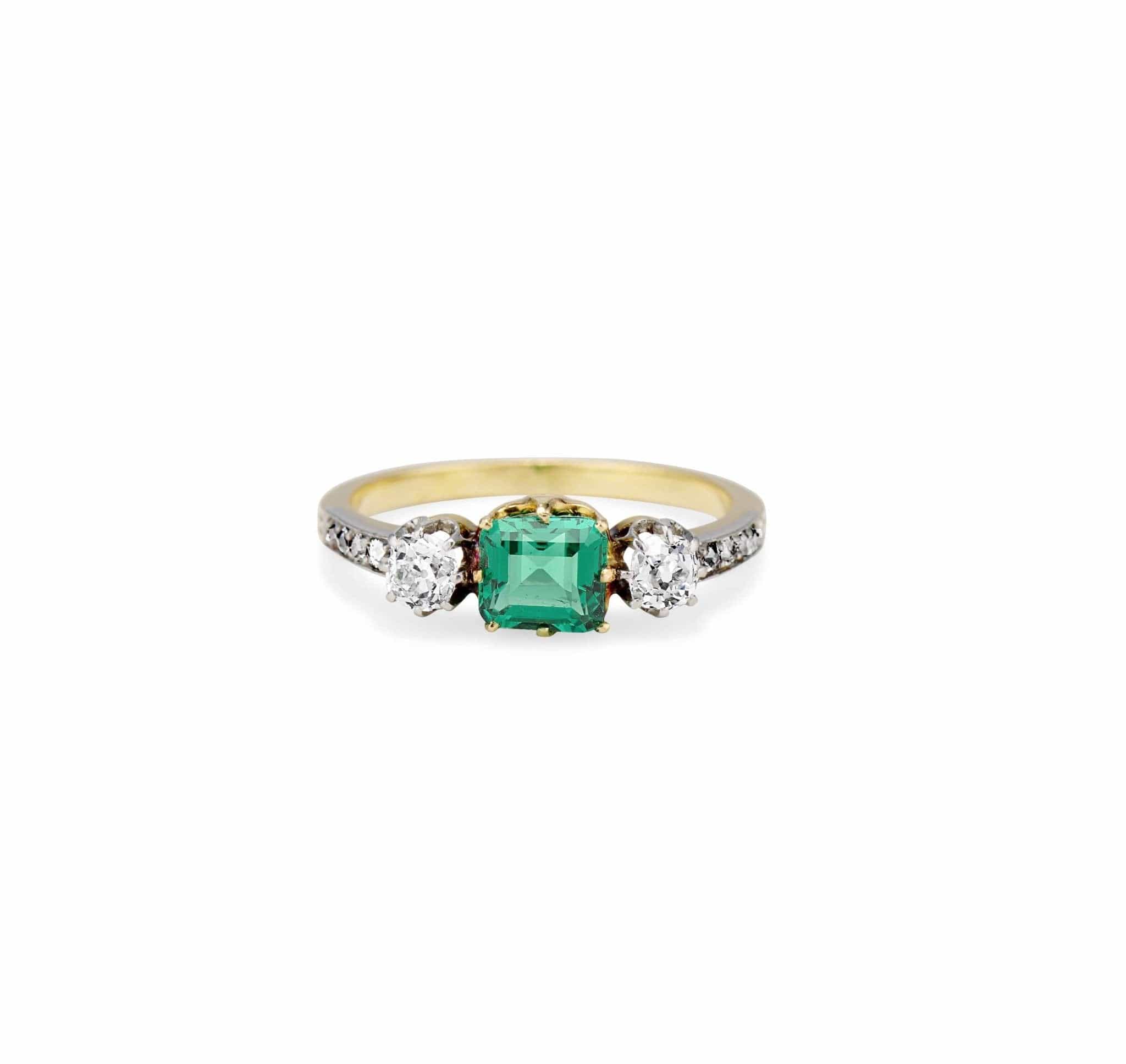 Late Edwardian .71 Carat Colombian Emerald-Cut Emerald and Diamond Three-Stone Ring