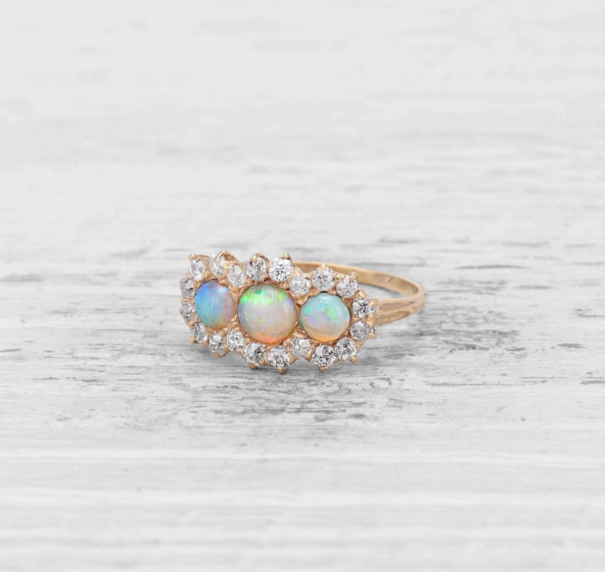 VICTORIAN THREE-STONE OPAL AND DIAMOND ENGAGEMENT RING